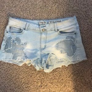 Light blue high waisted denim shorts.